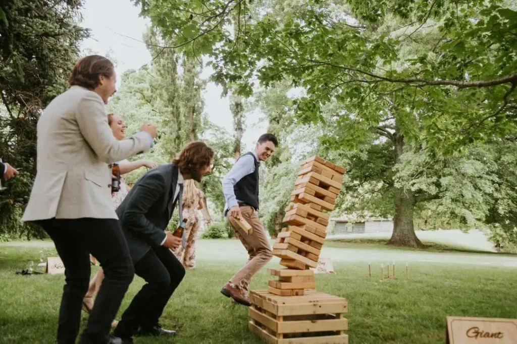 guests playing oversized lawn games at summer wedding reception in Okanagan BC