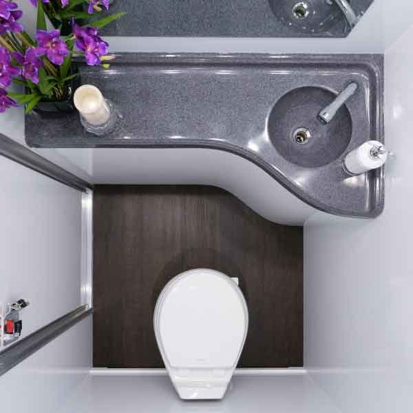 Interior of washroom trailer showing clean facilities and lighting for BC event rental