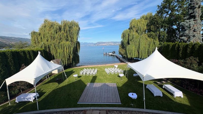 20x60 high-top marquee tent for a corporate event with outdoor seating in Kelowna
