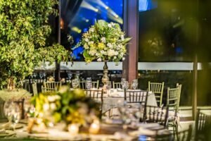 Gold chiavari chairs with ivory cushions arranged at elegant outdoor wedding reception in Okanagan BC