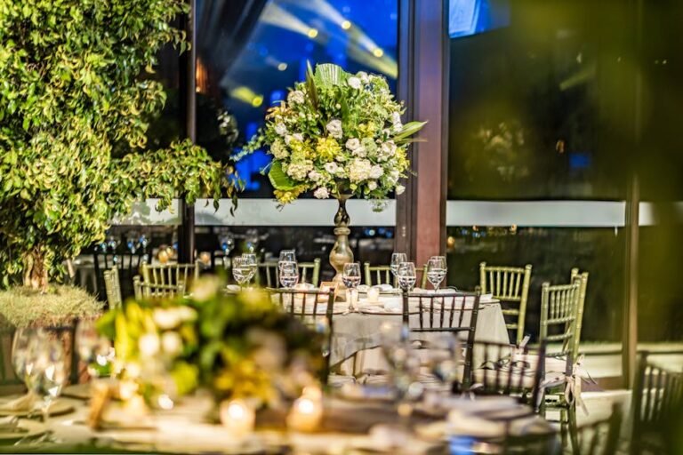 Gold chiavari chairs with ivory cushions arranged at elegant outdoor wedding reception in Okanagan BC
