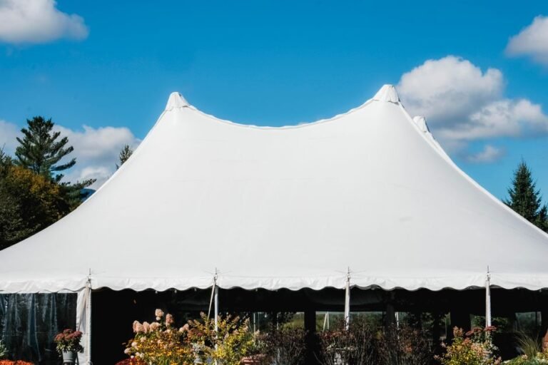 large marquee tent setup for corporate event rentals Okanagan with mountain backdrop