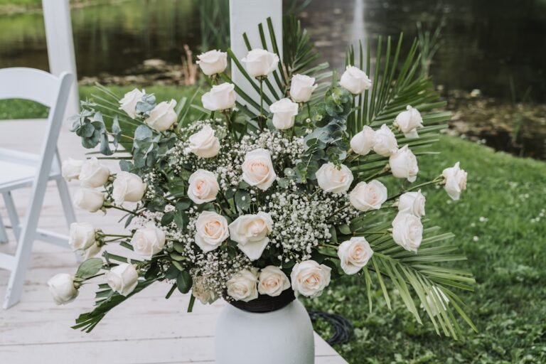 wilted fresh roses compared to artificial flowers at outdoor BC wedding reception in 30-degree heat
