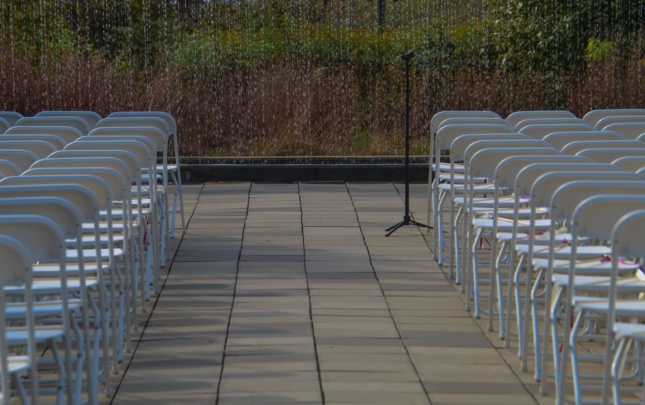 outdoor wedding ceremony setup with microphone stand near arbour in Okanagan BC